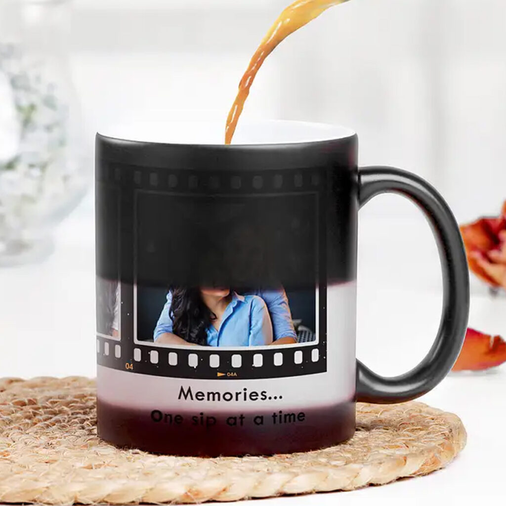 Personalized black magic mug with three custom photos and reel-type heat-reveal design