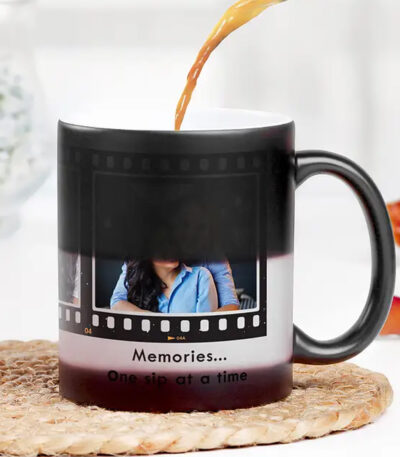 Personalized black magic mug with three custom photos and reel-type heat-reveal design