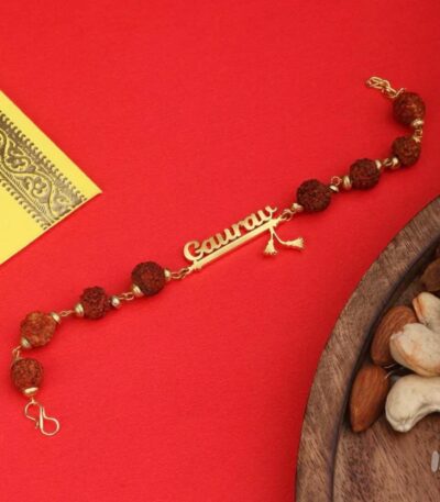 Customized Rudraksha name Rakhi bracelet with natural Rudraksha beads, gold-finish engraved name plate, and adjustable chain.