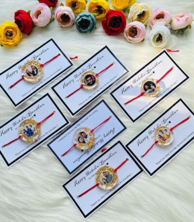 Personalized resin photo Rakhi with a custom picture, gold foil accents, and traditional red thread for Raksha Bandhan.