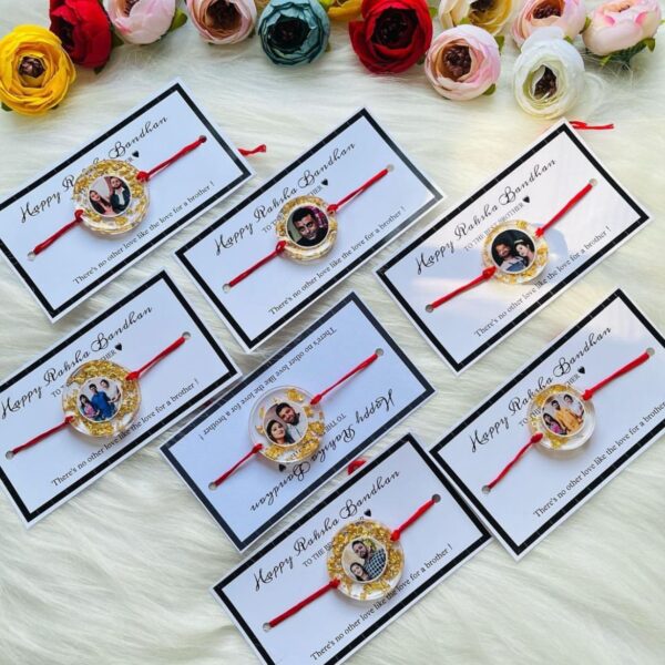 Personalized resin photo Rakhi with a custom picture, gold foil accents, and traditional red thread for Raksha Bandhan.