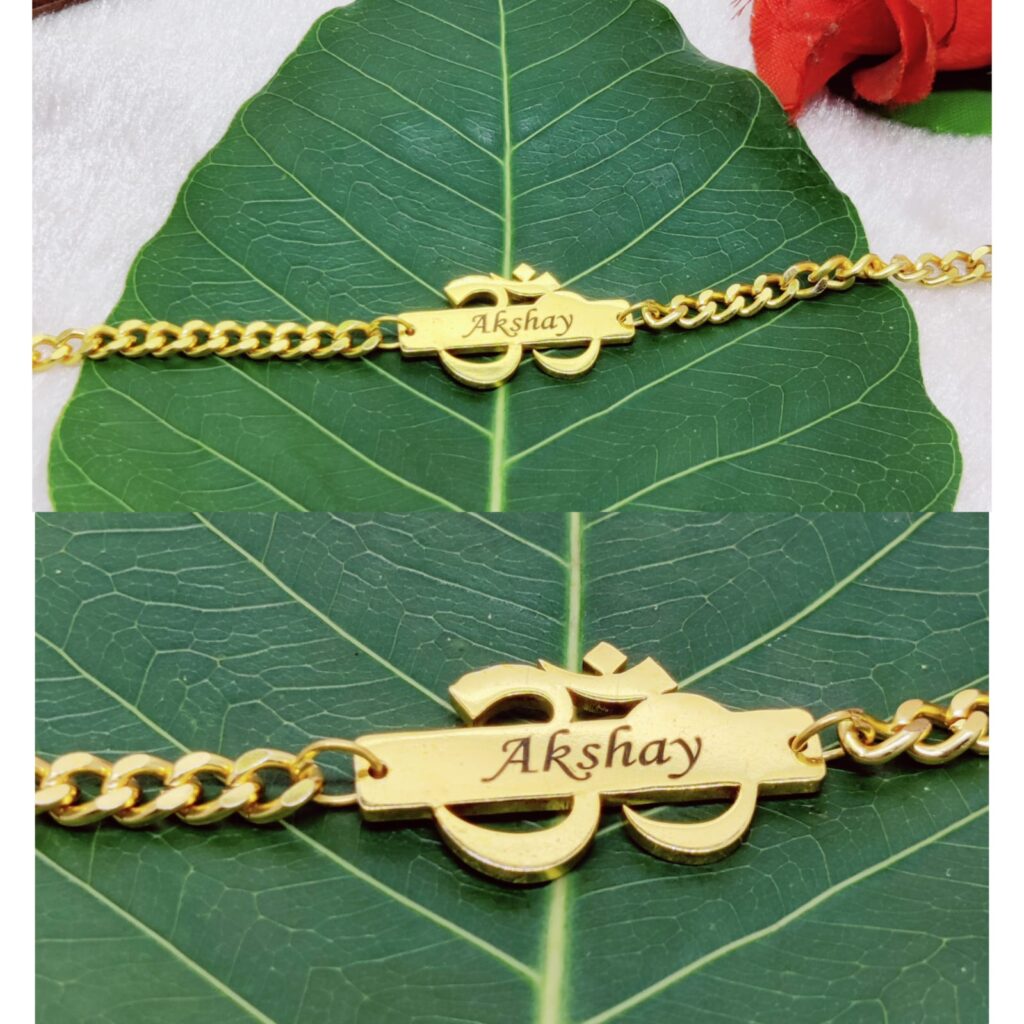 Personalized Metal Om Chain Rakhi with custom engraved name, gold-finish stainless steel Om symbol, and adjustable chain bracelet for Raksha Bandhan.