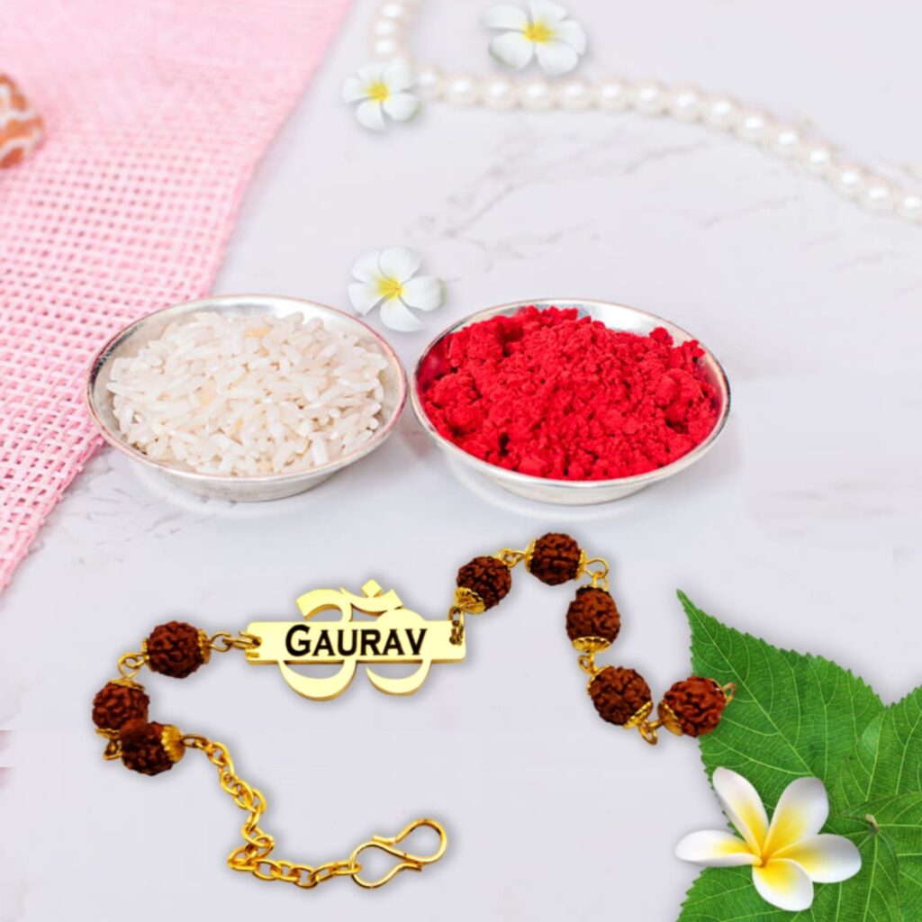 Personalized Om Rudraksha Rakhi bracelet with engraved name, sacred Om symbol, genuine Rudraksha beads, and adjustable gold-finish chain.