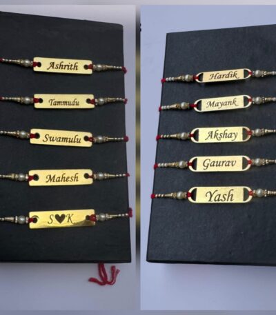 Personalized gold name plate Rakhi with custom engraved name, pearl bead accents, and traditional red thread for Raksha Bandhan.